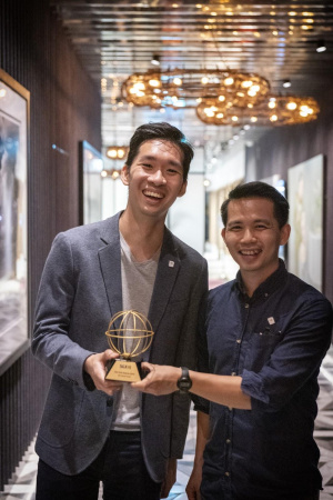 The Woke Salaryman co-founders Goh Wei Choon (left) and He Ruiming (right) pictured with their SGX Orb Award in September 2019.
