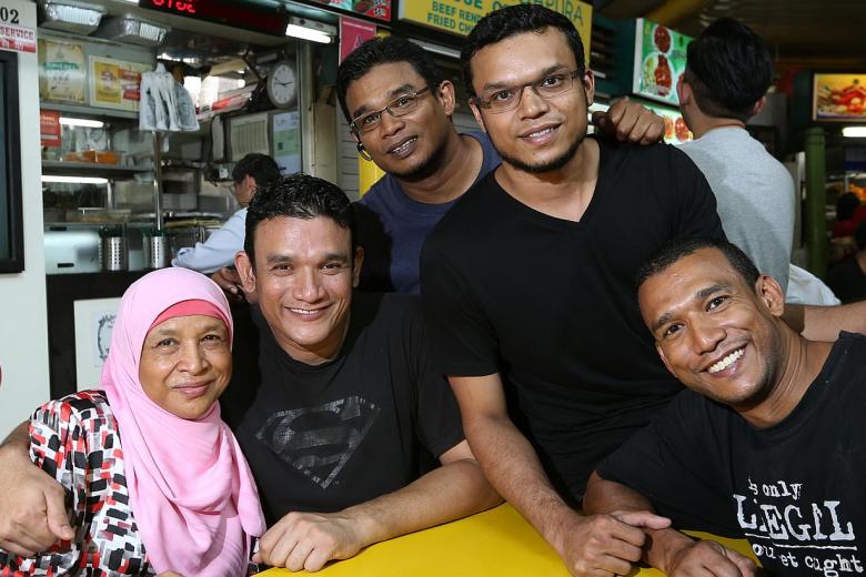 File:Abdul Malik photographed with his mother and brothers. Photo from The Straits Times..jpg