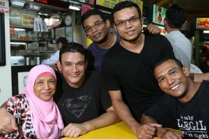 Abdul Malik photographed with his mother and brothers. Photo from The Straits Times..jpg