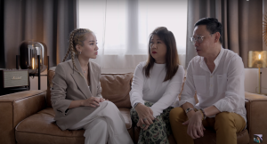 A screenshot of Naomi Neo with her parents in her adoption YouTube video. Photo from YouTube.