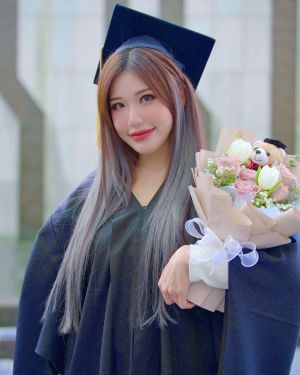 Ms Puiyi at her graduation.jpg